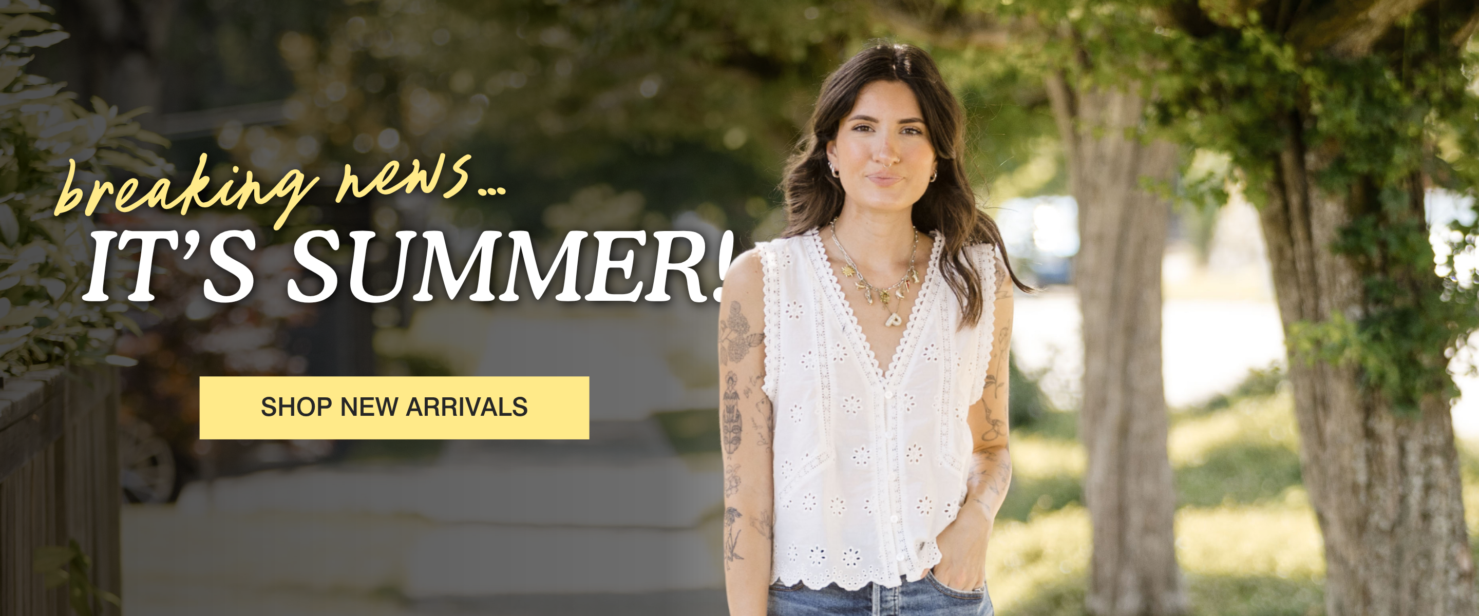 A woman stands outdoors in front of trees wearing a white sleeveless lace top and blue jeans. Large overlaid text reads 'breaking news.
