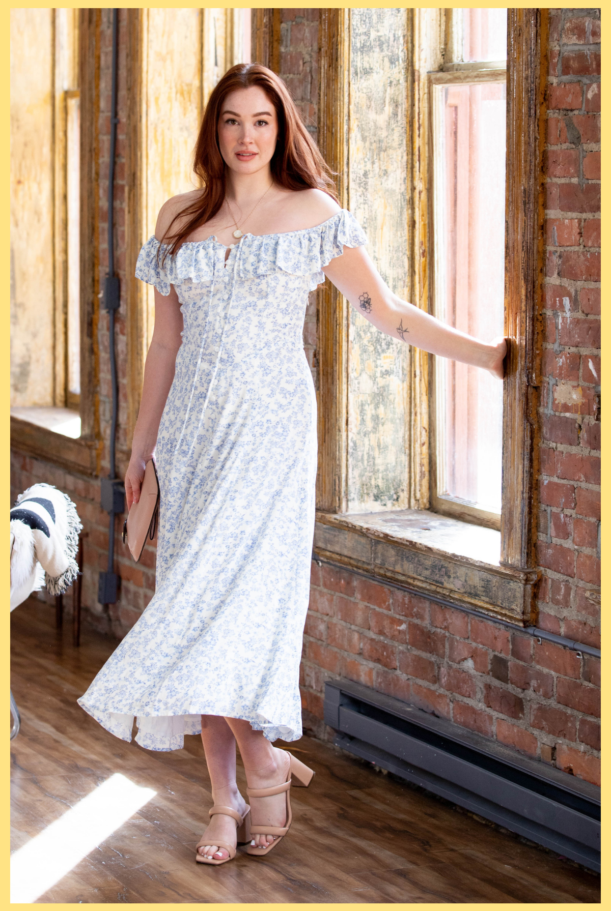 Dresses Collection at Vixen Collection Boutique in Seattle WA | Red headed girl wearing a sleeveless blue and white floral print dress. 